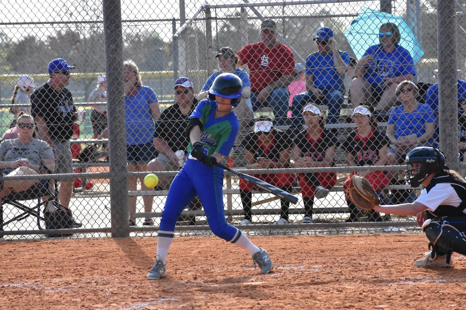 Emily LaFave mid swing, about to hit a pitch