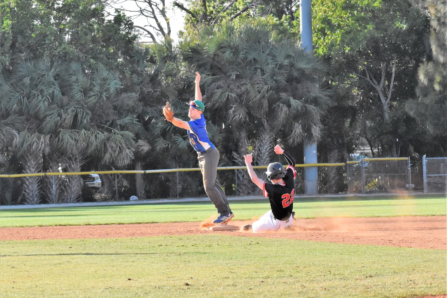 Jeff Allen stretches to catch a ball on second base as a runner slides in