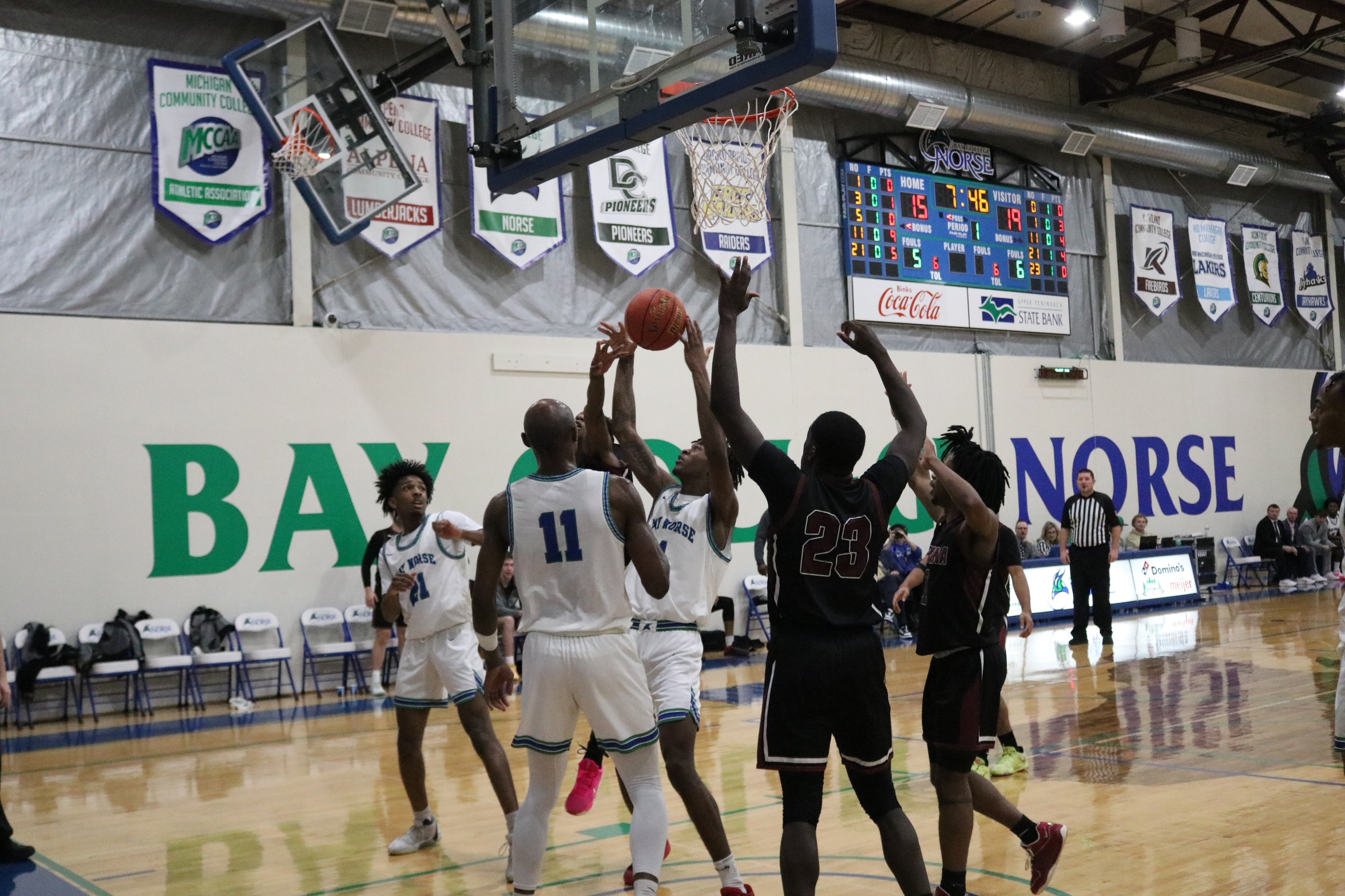 Ibrahim Diatke pulls down a rebound in the midst of several other players