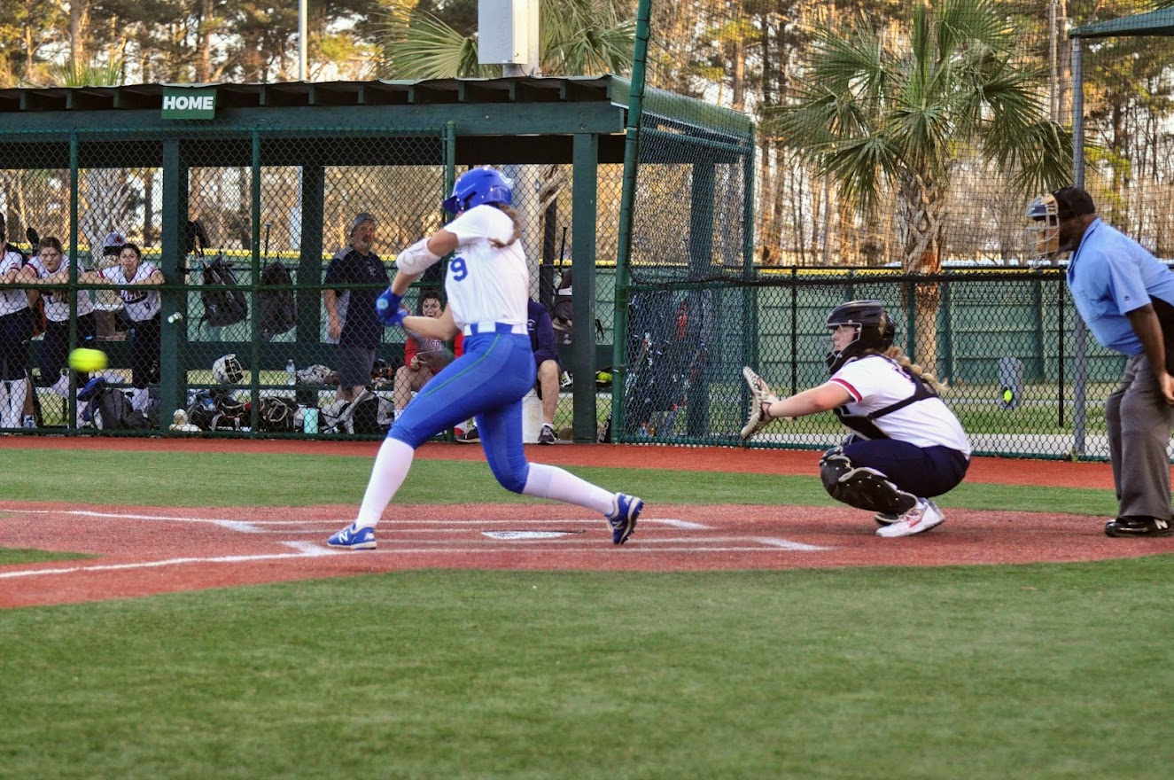 Natalie Belanger taking a swing at the incoming pitch