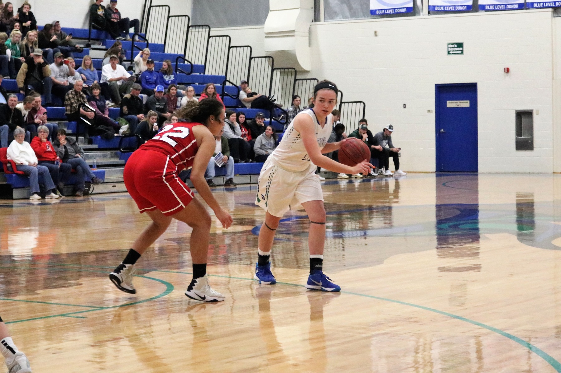 Kaitlyn Hardwick dribbles to her left, a defender close by