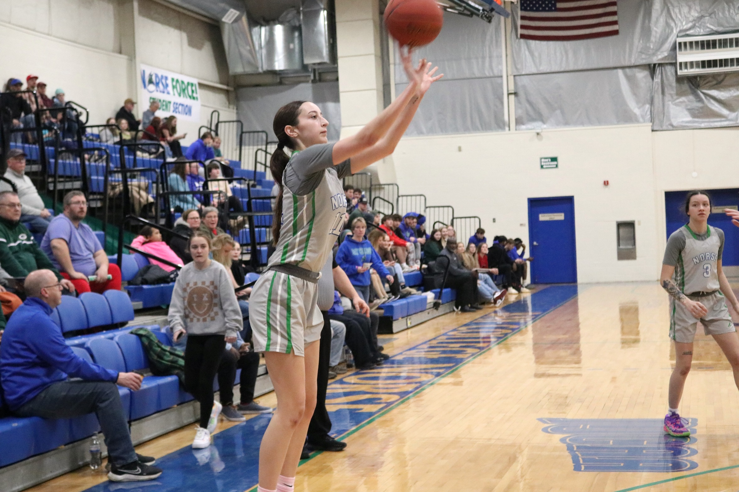 Kennedy Sproule releasing a three in front of the home crowd