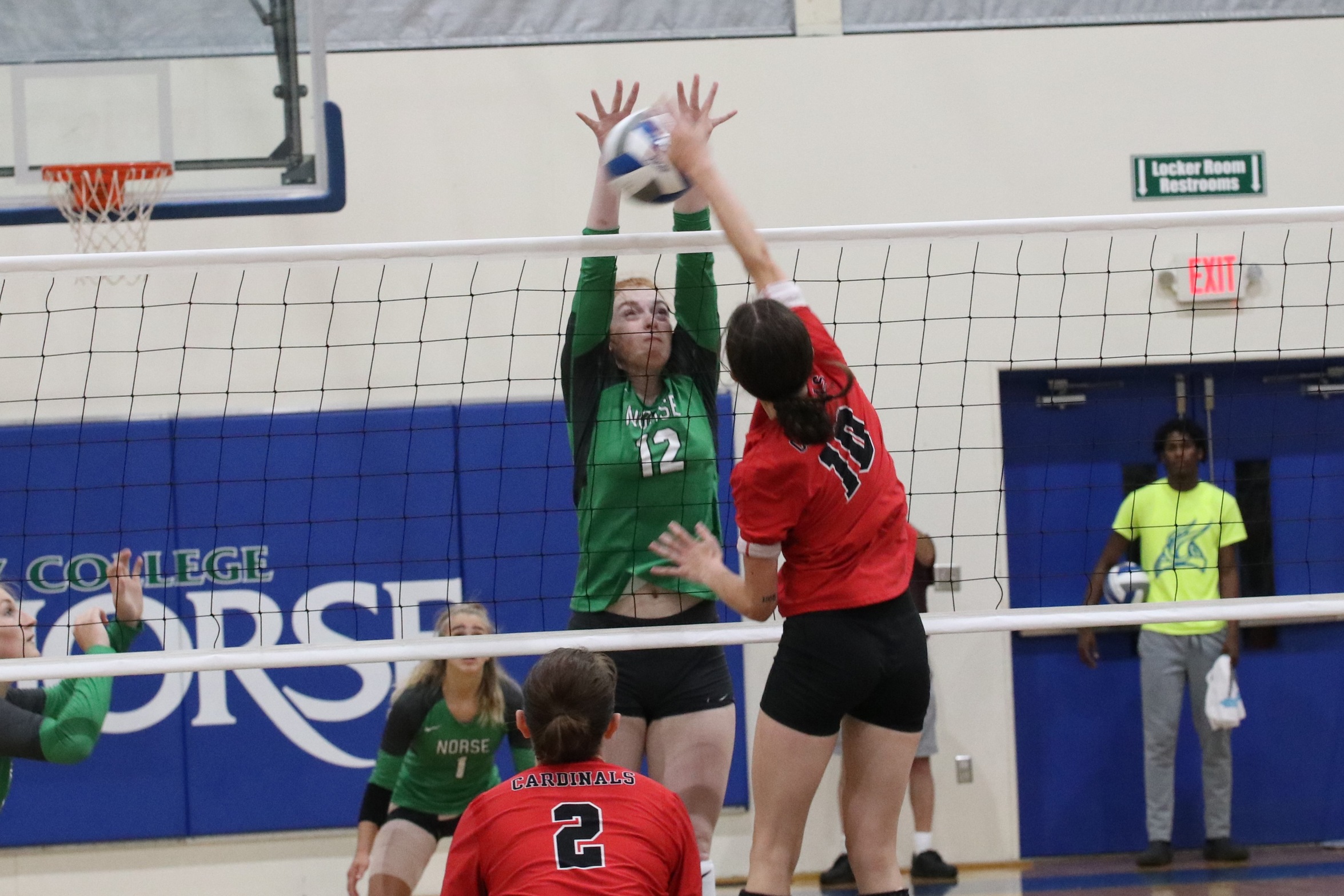 Kylee Tadish stares down the ball as she collects one of her six blocks